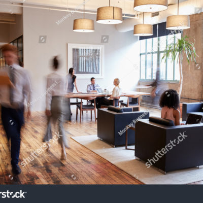 stock-photo-business-people-at-work-in-a-busy-luxury-office-space-796346002