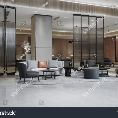 stock-photo-hotel-lobby-interior-with-reception-desk-sofas-marble-floor-and-long-bar-1269458383